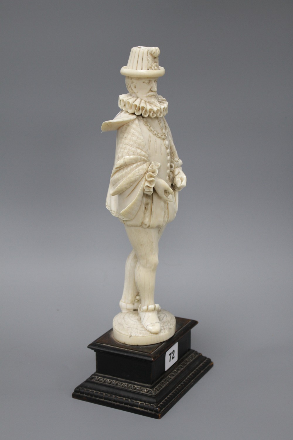 A 19th century Dieppe carved ivory figure of a 17th century gentleman, standing and wearing a ruff colour, height 30cm,